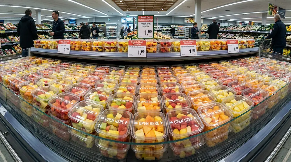 12oz PET rPET tamper-evident fresh-cut fruit containers in supermarket chilled island promotion