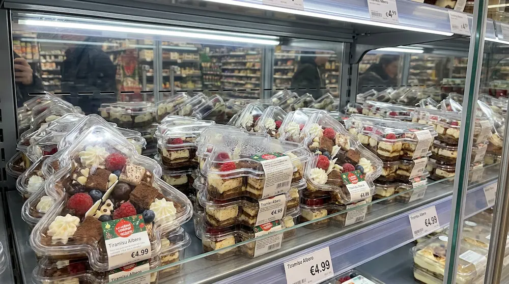 Clear PET Christmas tree dessert boxes on European supermarket chilled dessert shelf