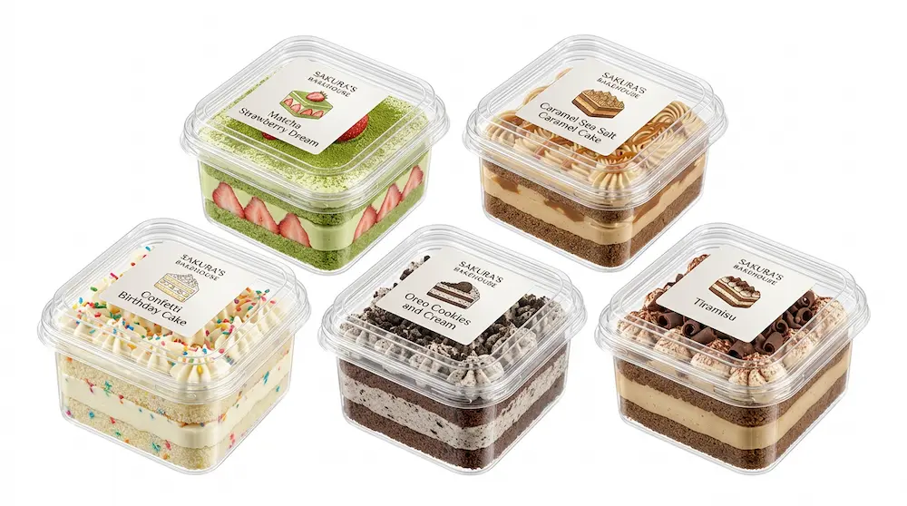 Clear PET/RPET square dessert containers with branded labels for matcha strawberry, caramel, birthday cake, Oreo cookies and cream, and tiramisu desserts.