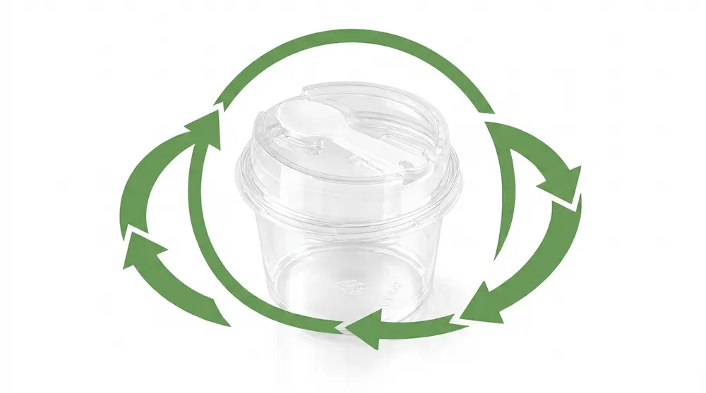 Clear round PET dessert cup with integrated spoon lid and green recycling arrows