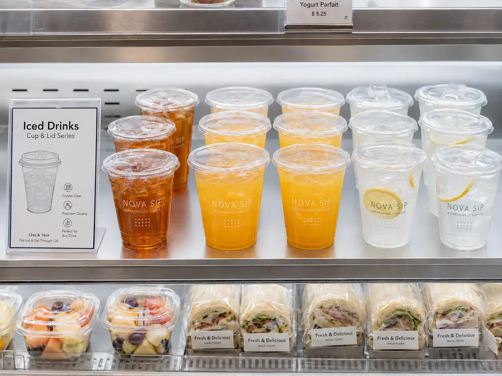Clear PLA drink cups in refrigerated retail display for iced drinks and grab-and-go service