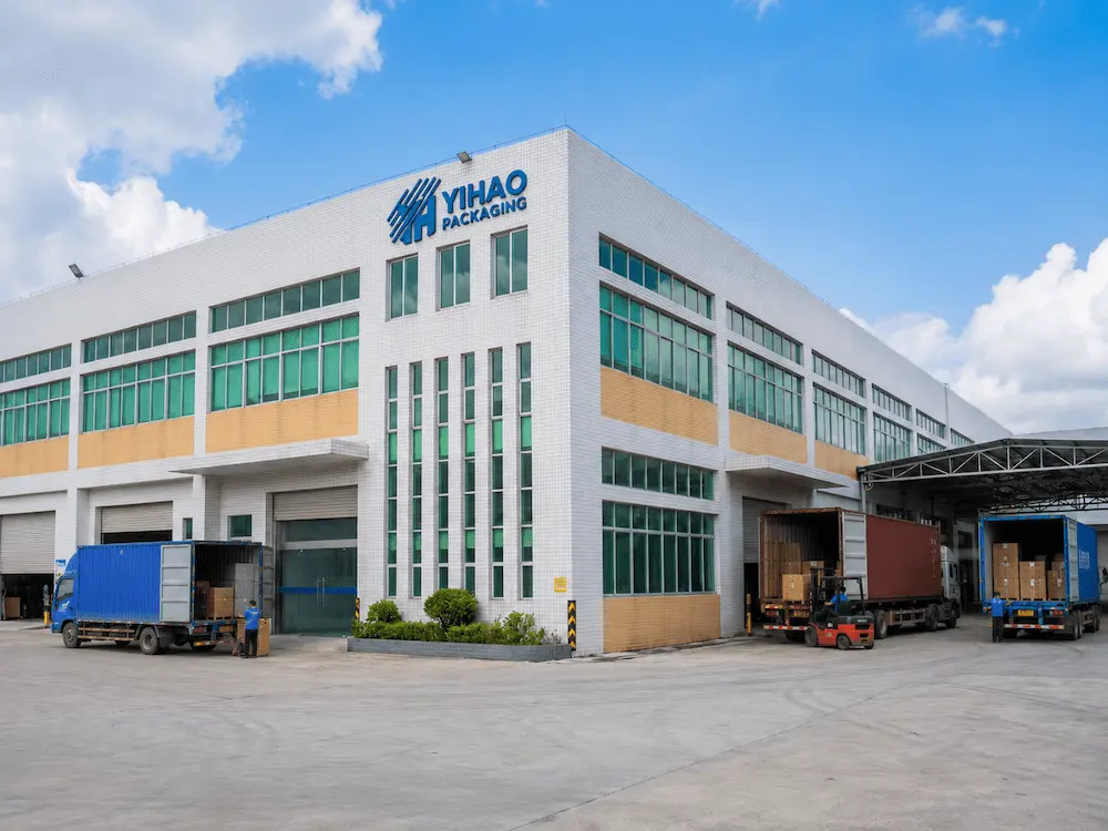 YIHAO Packaging factory exterior with loading containers for wholesale cup supply
