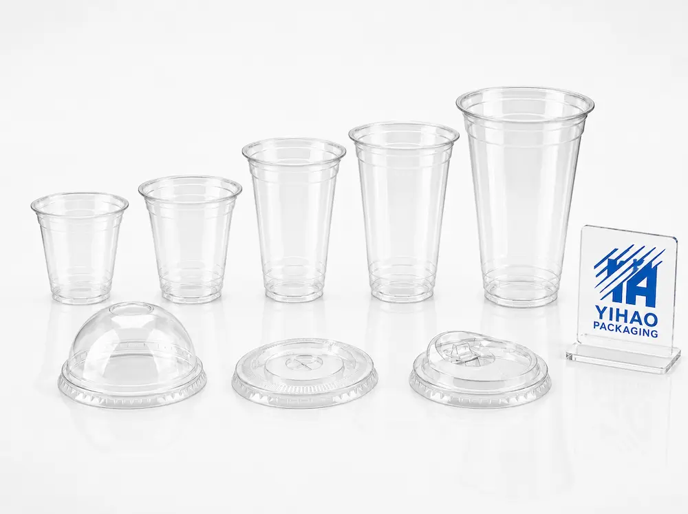 YIHAO Packaging clear PET coffee cups and lids studio shot showing high transparency and rigid design