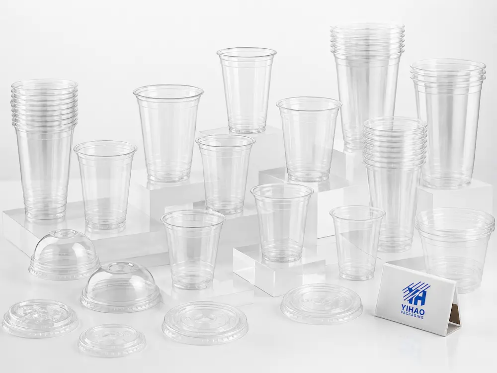 Clear PET cold cups and matching lids displayed as a complete product range for wholesale buyers