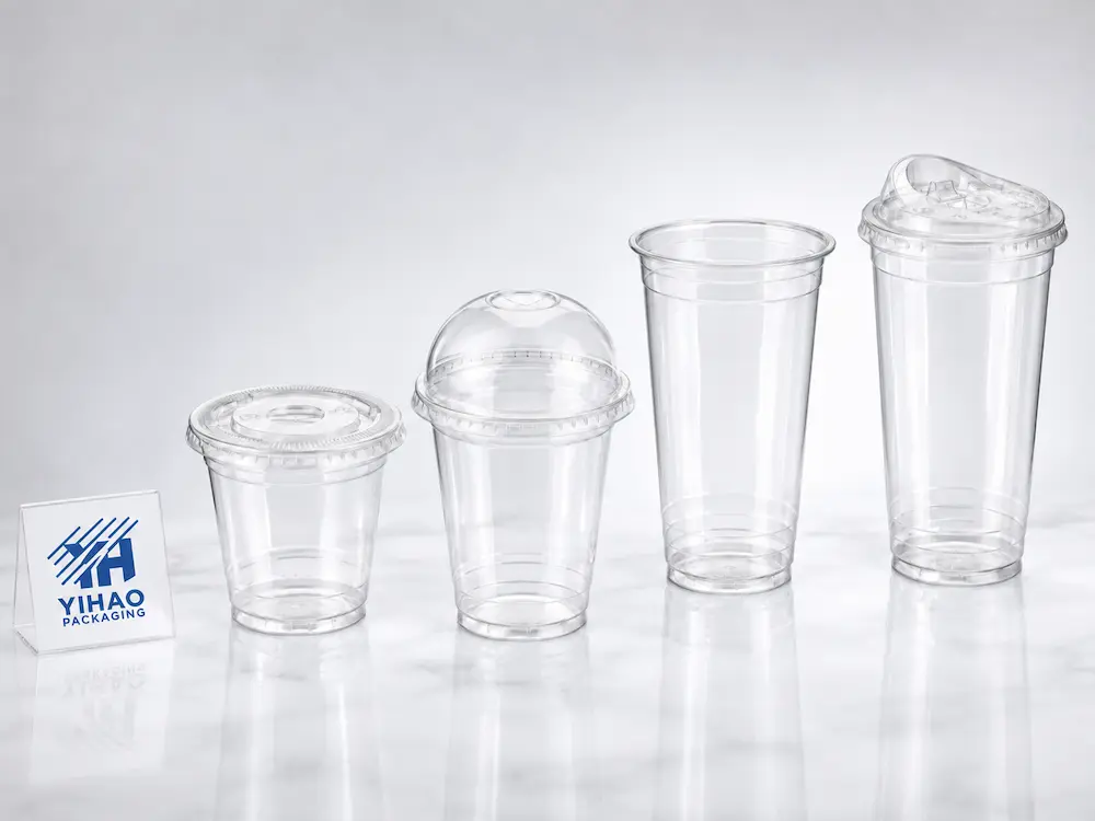 Clear PET cold cup and lid system with flat, dome, and strawless sipper lid options