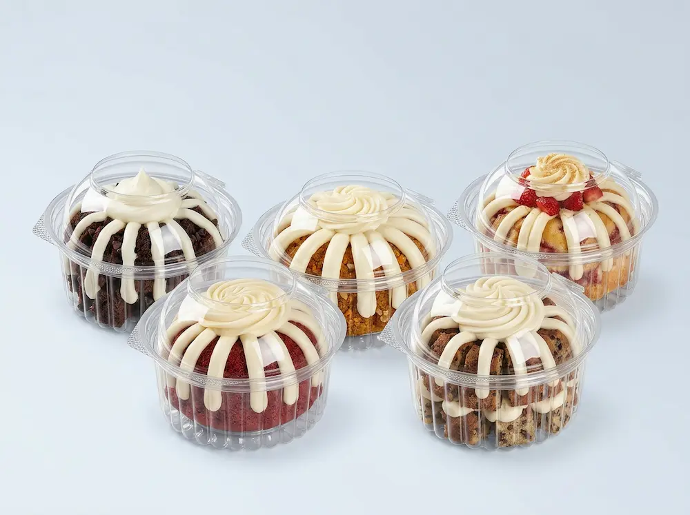 Clear PET round bakery containers with dome lids for mini cakes, muffins, cupcakes, and chilled dessert packaging