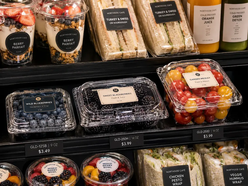 Clear fruit clamshell containers for grab-and-go cafe and convenience store display