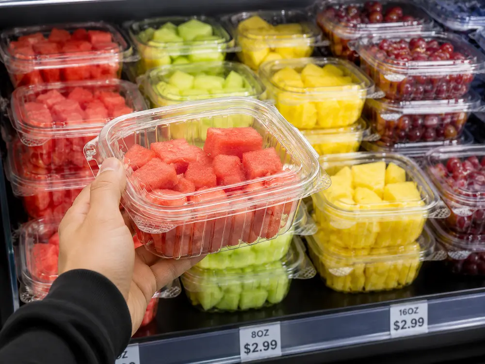 Grab-and-go fruit container with secure lid for takeaway convenience