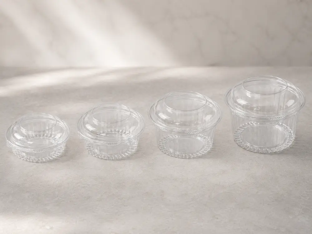 Four clear PET hinged deli containers in different sizes for deli food and salad packaging