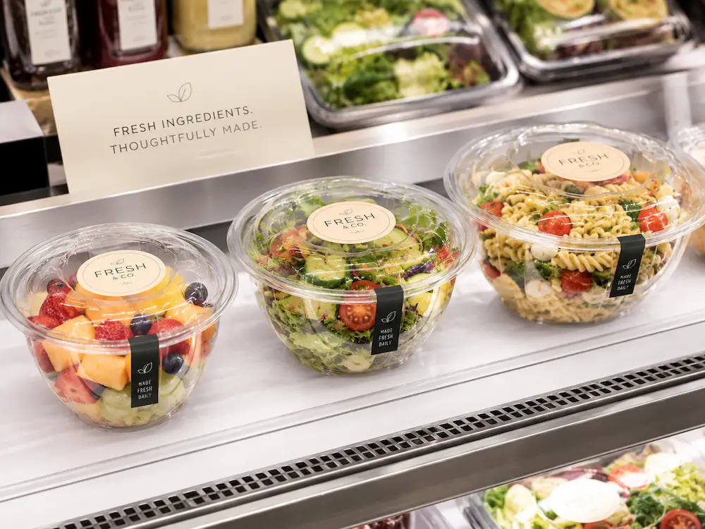 Clear PET round bowls with lids for fresh salad, fruit, pasta salad, and chilled deli food display