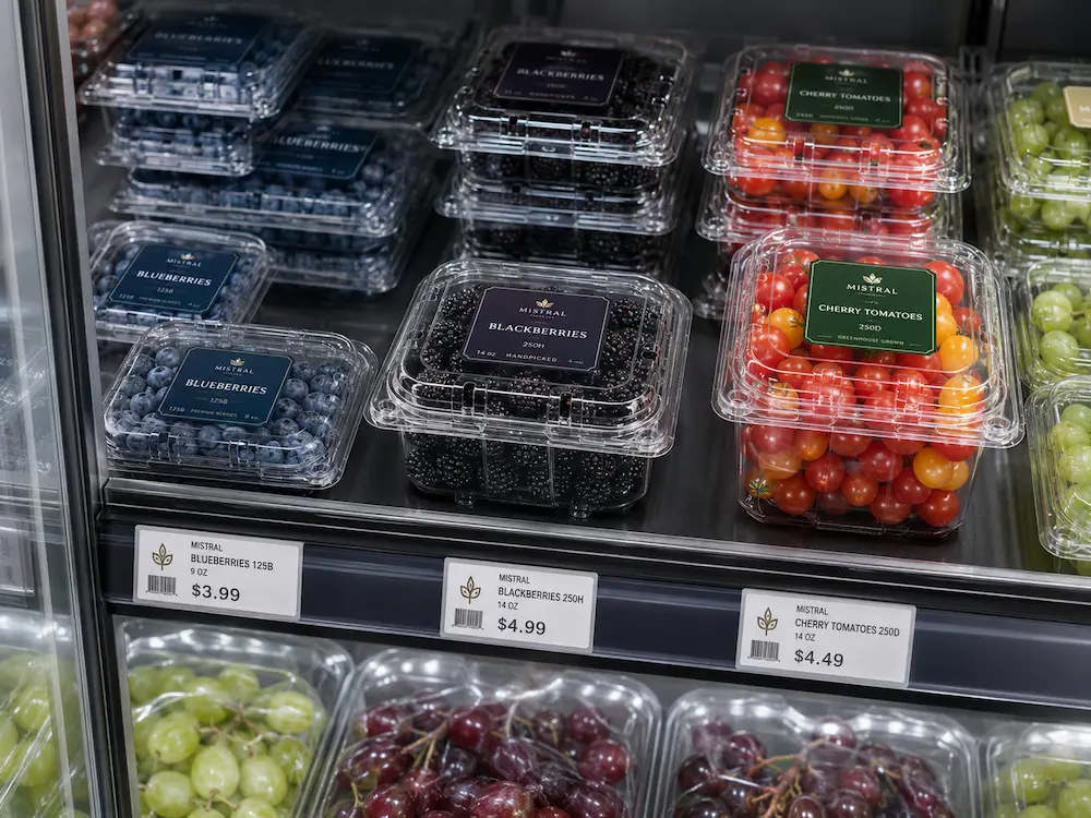 Shelf Life Packaging: Buyer Guide for Food Packaging Teams 5 Refrigerated produce display with clear fruit clamshell packaging for berries tomatoes and grapes
