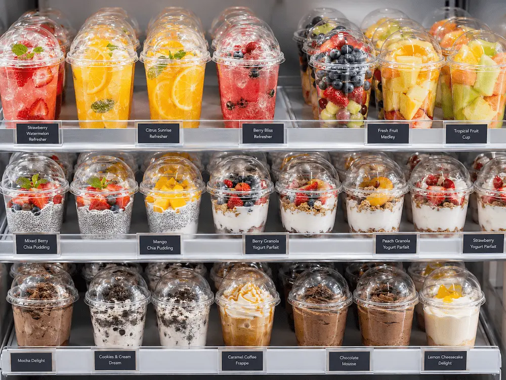Dome Lid Cups FAQ: Materials, Sizes, Uses, and Ordering Questions 5 Retail display of dome lid cups for berry refreshers, fruit cups, chia pudding, and dessert drinks